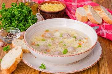 Chicken soup with meatballs and noodles