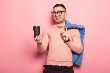 Handsome man in bright jacket with coffee cup