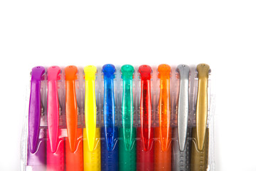 A set  colored pens on a white background