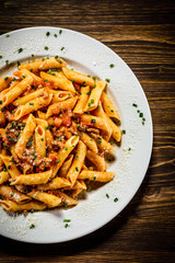 Penne with meat, tomato sauce and vegetables