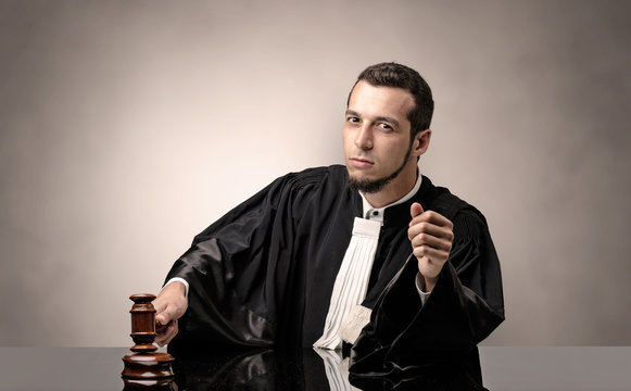 Oldscool young judge in gown