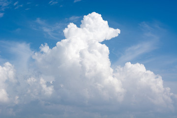 Naklejka na ściany i meble Big beautiful cloud in the blue clear sky in summer sunny day concept