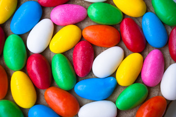 Easter background with colorful candy eggs