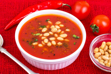 Hot spicy tomato soup with white beans and chili