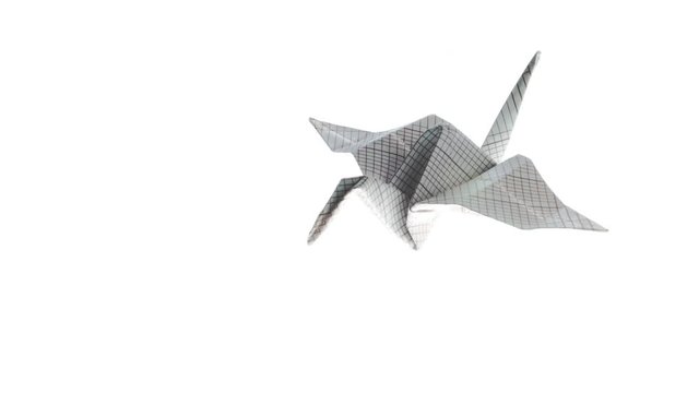 Beautiful heron origami crane animated flying to the right top corner on a white background. 4K video