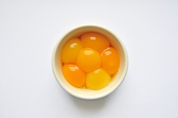 Egg yolks in white bowl
