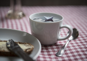 Small Paper Boat in a Cup