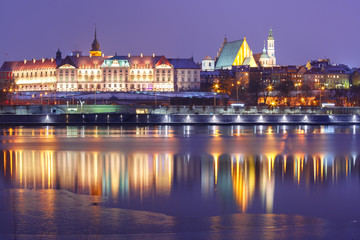 Fototapeta na wymiar Old Town with reflection in the Vistula River during evening blue hour, Warsaw, Poland.