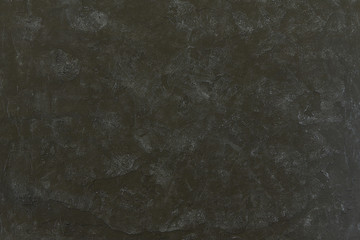 Cement wall of black background with drawing of gray color for drawing of a texture.