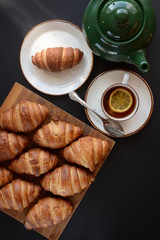 Fresh croissant on a black background.  