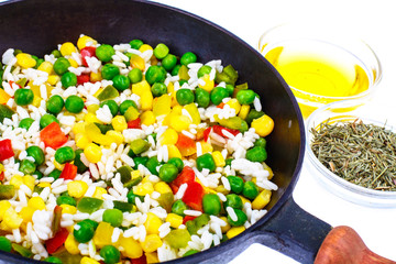 Frozen Hawaiian mix of vegetables with rice in frying pan
