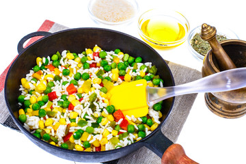 Frozen Hawaiian mix of vegetables with rice in frying pan