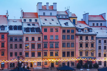 Fototapeta na wymiar Old Town Market Place with colorful houses during morning blue hour, Warsaw, Poland.