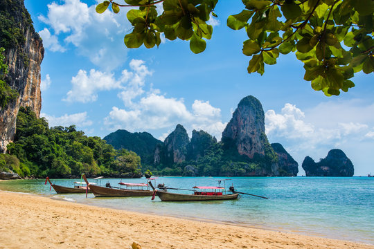 Amazing view of beautiful Ao Nang Beach with longtale boats. Location:  Krabi Province, Thailand, Andaman Sea. Artistic picture. Beauty world.