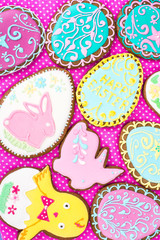 Colorful вelicious Easter gingerbread cookies background. Eggs, rabbit, chicken  with different pattern icing. Top view