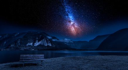 Mountain and lake at night with stars