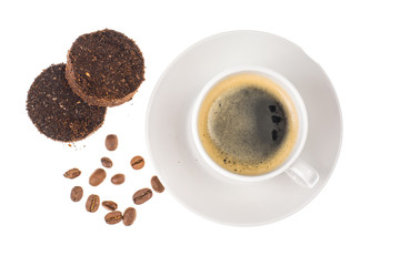 White cup with espresso, waste from the coffee machine
