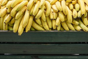 Bunches of bananas on the supermarket counter