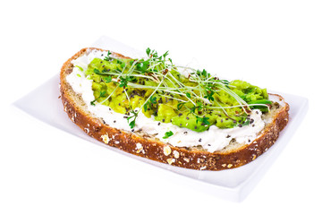 Healthy eating. Multi-grain bread with avocado and sprouts cress lettuce