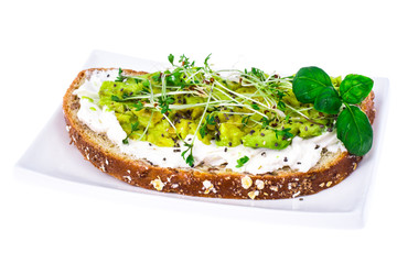 Healthy eating. Multi-grain bread with avocado and sprouts cress lettuce