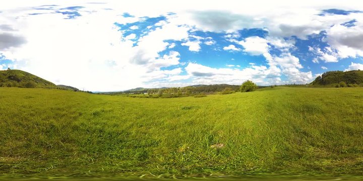 4K 360 VR virtual Reality of a beautiful mountain meadow timelapse at the summer or autumn time. Wild Russian nature and rural meadow. Clouds, green grass and sun rays.