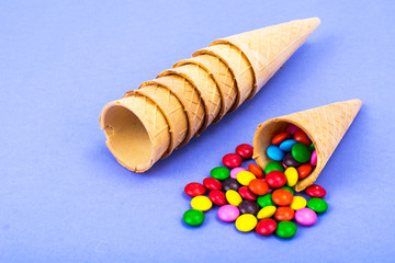 Crispy waffle cones with colorful candies