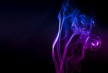 Obraz premium Colored smoke on black background