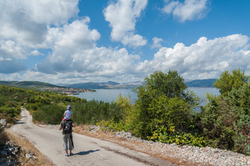 Admiring view over Slatine village in Croatia. Great place to find accommodation close by to many worth visiting UNESCO heritage towns like Trogir, Split, Hvar. 