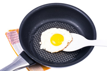 Chicken egg fried in frying pan