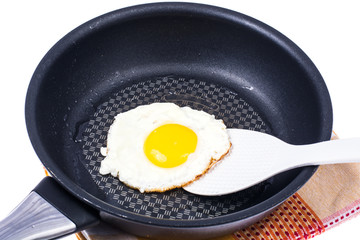 Chicken egg fried in frying pan
