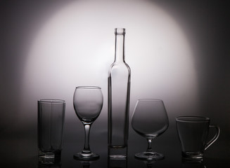 Glass transparent dishes on a gray graded background
