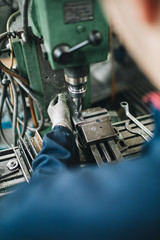 Metallurgy heavy industry. Factory for production industrial machines. Low light close up shot.