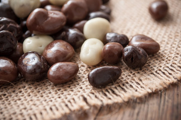 closeup of chocolate candies on hessian texture