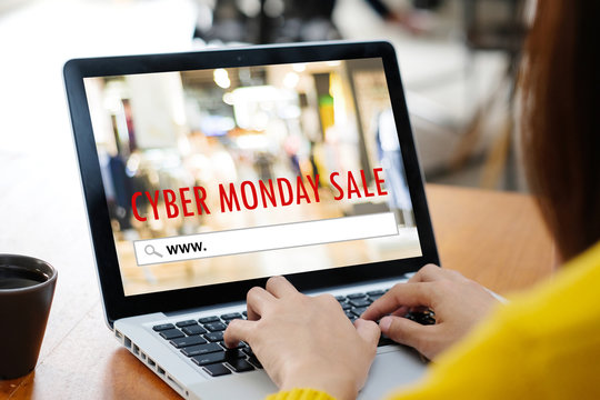 Woman hands typing laptop computer with www. on search bar over cyber monday sale banner background, Online shopping, business and technology