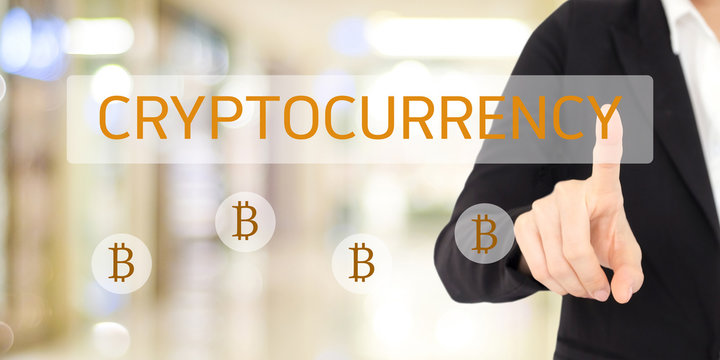 Cryptocurrency and Bitcoin concept, Businesswoman hand touch cryptocurrency and bitcoin icon over blur background, banner