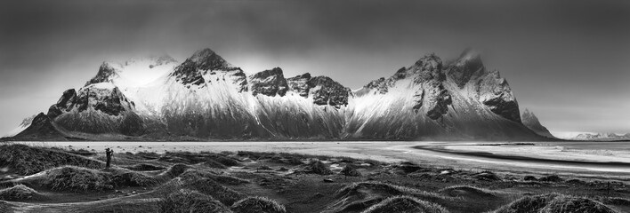 Vestrahorn mountain range and Stokksnes beach panorama, near Hofn, Iceland. An unidentifiable photographer captures the scenery.