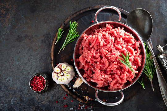 Cooking Mince. Raw Ground Veal Meat With Ingredients For Cooking On Black Kitchen Table. Fresh Minced Meat, Top View