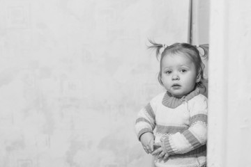 Fototapeta premium little girl standing at home