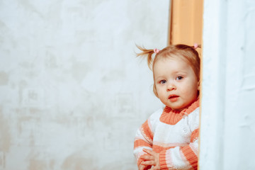 Fototapeta premium little girl standing at home