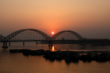Yadanarbon bridge at sunset over Ayeyarwady River, Modern bridge in Mandalay division, Burma