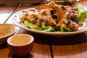 Tea fried chicken on table