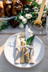 Table setting. Plate, fork and knife in rustic style