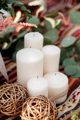 White candles. Rustic style outdoor decoration