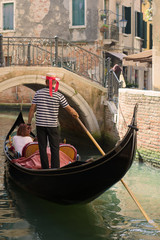 Fototapeta na wymiar A walk on the gondola along the city canal. Venice 