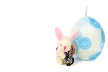 cute little handmade bunny and a white and blue easter candle egg