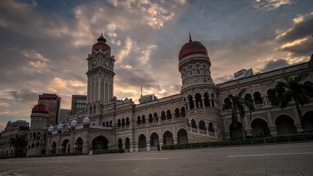 KUALA LUMPUR - MARCH 10: A beautiful moving cloud and sunrise view of The Sultan Abdul Samad Building on March 10, 2018 in Kuala Lumpur.
