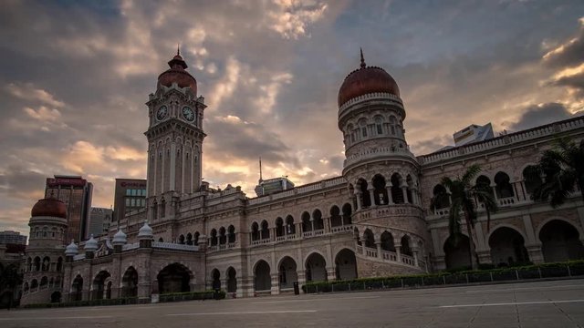 KUALA LUMPUR - MARCH 10: A beautiful zooming out of moving cloud and sunrise view of The Sultan Abdul Samad Building on March 10, 2018 in Kuala Lumpur.