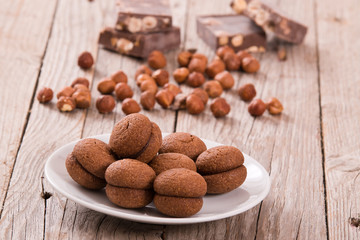 Hazelnut shortbread sandwiches filled with chocolate cream