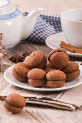 Hazelnut shortbread sandwiches filled with chocolate cream