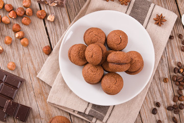 Hazelnut shortbread sandwiches filled with chocolate cream